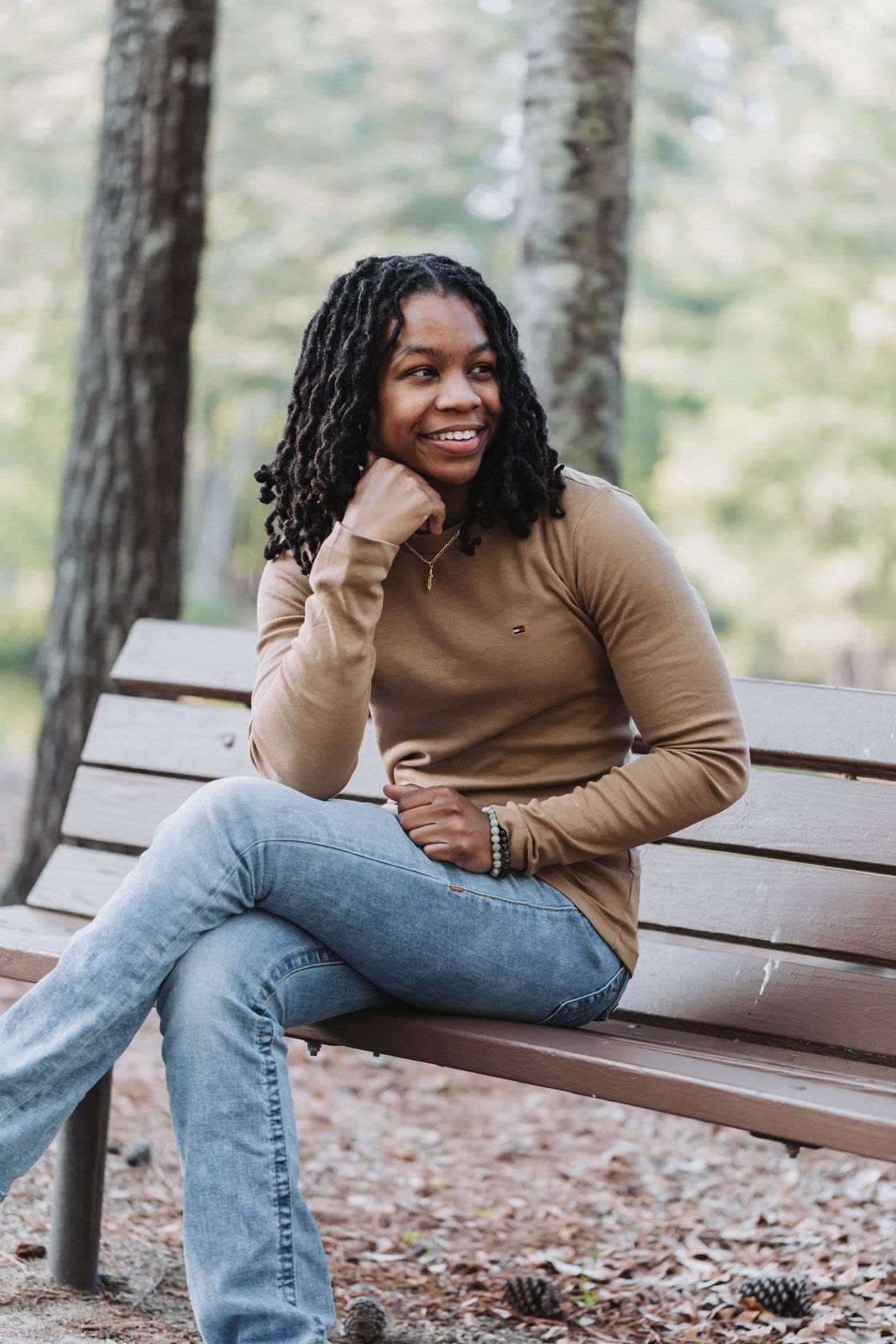Woman smiling on a park bench